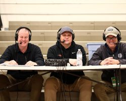 Scott Kindberg, right, with, WJTN radio broadcast crew Tom Ames, left, and Jim Brown at McElrath Gymnasium on February 12, 2026.