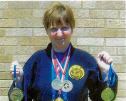 Christina Kebort displays her 7 World Championship medals.