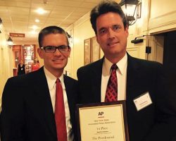Scott Kindberg with his son Matthew and his AP first place award. 2015.