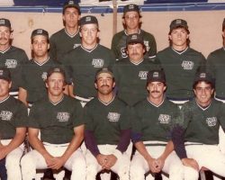 1984 ASA National Softball Champions front row left to right: Bob Schmitt (holding Corey Schmitt), Bob Burns, Joe Mistretta, Dan Harnish, John Mancari back row left to right: Bruce Sprankle, Rich Pinciaro, Pete Caprino, John Woodfield, Jim Brooks, Terry Woodfield, Steve Bowman, Dave Boughton.