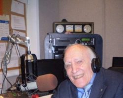 Jim Roselle in the WJTN studio with his cup of happiness.