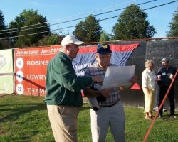 Jack Keeney shows Ron Melquist a picture of Celoron Park.