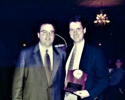John Murphy with Scott Kindberg as he receives the Stan Barron Award. 2000.
