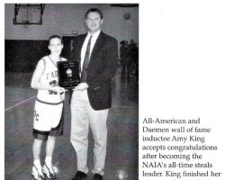 Amy King receiving all-time steals leader award.