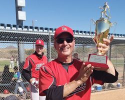 Charlie LaDuca holding the championship trophy.