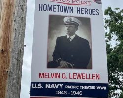 Mel Lewellen's "Hometown Heroes" banner hanging in Bemus Point, NY. 2024.