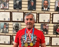 Mike Sayers is wearing two gold medals he earned for javelin and discus in the 70-74 age group at the Connecticut Masters Games in Middletown, CT on May 19, 2026.