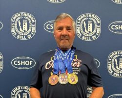 Mike Sayers displays his Ohio Senior Olympics medals,