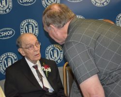 High school football official Dave Kolstee, right, speaks to longtime Southern Tier official Elly Norton at 2020 CSHOF awards banquet. <em>Post-Journal</em> (Jamestown), February 18, 2020. P-J photo by Scott Kindberg. Norton-Kolstee