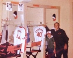Pete Criscione and son, Peter, standing in front of his brother Dave's locker.