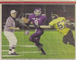 Larry Rodgers refs a football game in 2001.