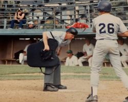 Larry Rodgers umpires a baseball game.