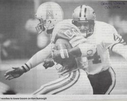 Chuck Crist readies to lower the boom on Ken Borrough. Oct 1976