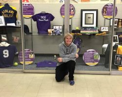 Sheilah Gulas at Ashland University trophy case.