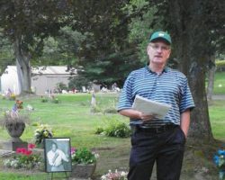 Tim Magnuson at Jimmy Clark's gravesite.