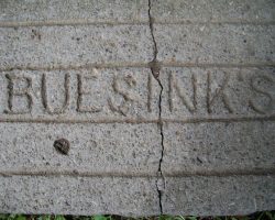 Sharyl Solsbee, owner of S.A.S. Motors, 3071 Fluvanna Avenue, Jamestown shared these relics of the location's connection to Julian Buesink. Her used car lot was formerly owned by Julian in the early 50s. The stone step that leads to her office is inscribed "Buesink's". Stone step that leads to office is inscribed "Buesink's".