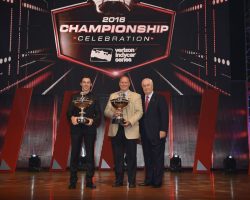 Championship Trophy flanked by driver Simon Pagenaud (left) and team owner Roger Penske (right).