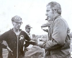 Post-Journal sportswriter Sherwood "Scrubby" Olson, right, chats with Southwestern Central School track and field star Brian Hull after a meet at Fredonia State College, 1973.
