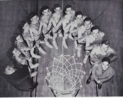 1950 Jamestown High School basketball team. Ted Olsen is directly in front of basket with glasses.